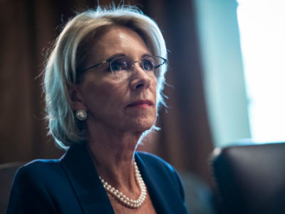 Secretary of Education Betsy DeVos listens as President Donald J. Trump speaks during a Cabinet meeting in the Cabinet Room of the White House on Thursday, Aug 16, 2018, in Washington, DC.