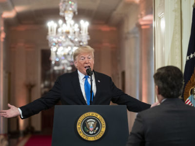 Donald Trump gets into an exchange with CNN reporter Jim Acosta during a news conference a day after the midterm elections on November 7, 2018, in the East Room of the White House in Washington, DC.