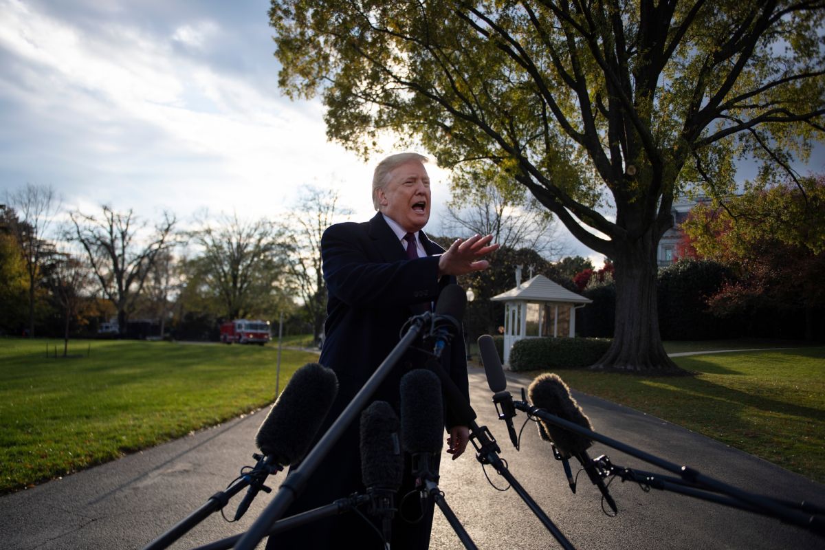 US President Donald Trump speaks as he departs the White House in Washington, DC, on November 20, 2018.