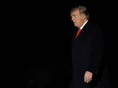 President Trump walks on the South Lawn after returning to the White House in the early morning hours from a trip to Mississippi on November 27, 2018, in Washington, DC.