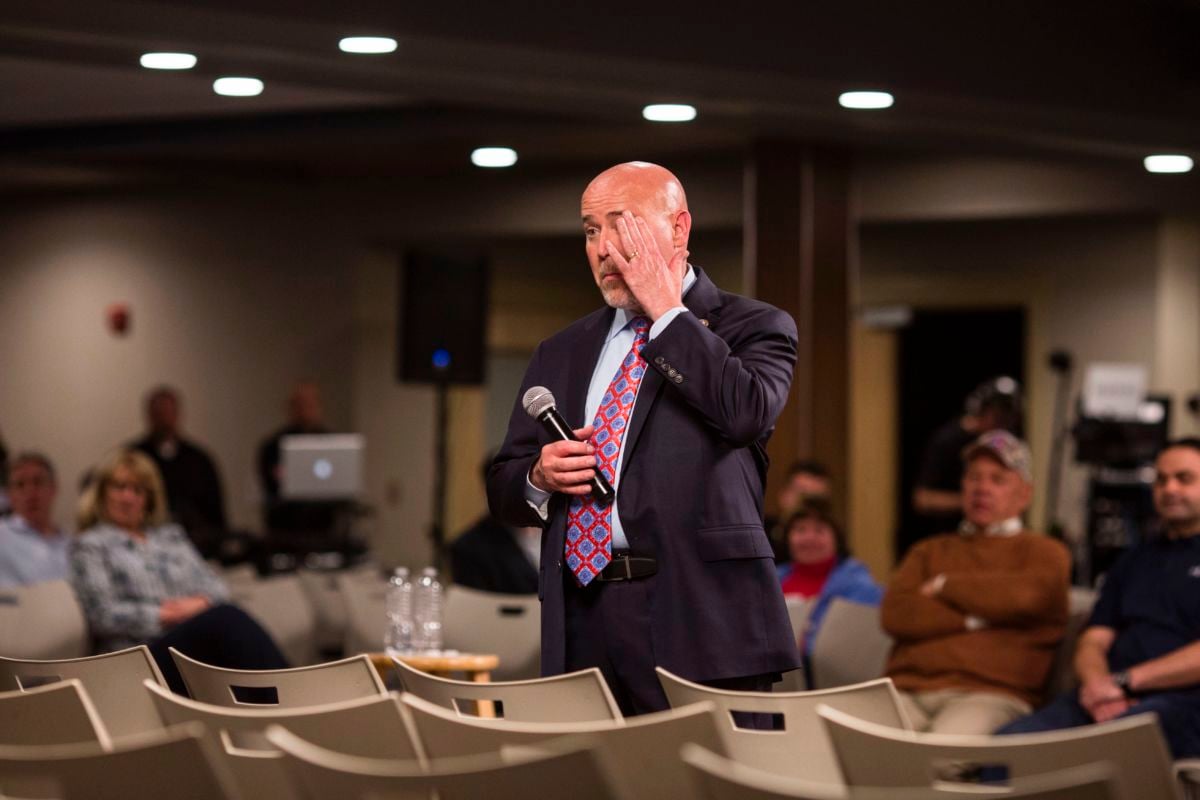 US Representative Tom MacArthur (R-NJ) wipes his brow after taking questions for nearly five hours during a town hall meeting in Willingboro, New Jersey on May 10, 2017. MacArthur wrote the amendment to the American Health Care Act that revived the failed bill, delivering a legislative victory for US President Donald Trump.
