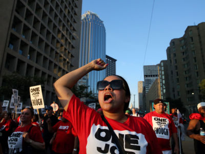 Members of UNITE HERE Local 26 march on Huntington Avenue after picketing for a new contract at the Westin Copley in Boston on September 3, 2018.