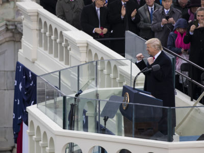 President Trump raises his fists to the crowd during the 58th US Presidential Inauguration in Washington, DC, on January 20, 2017.