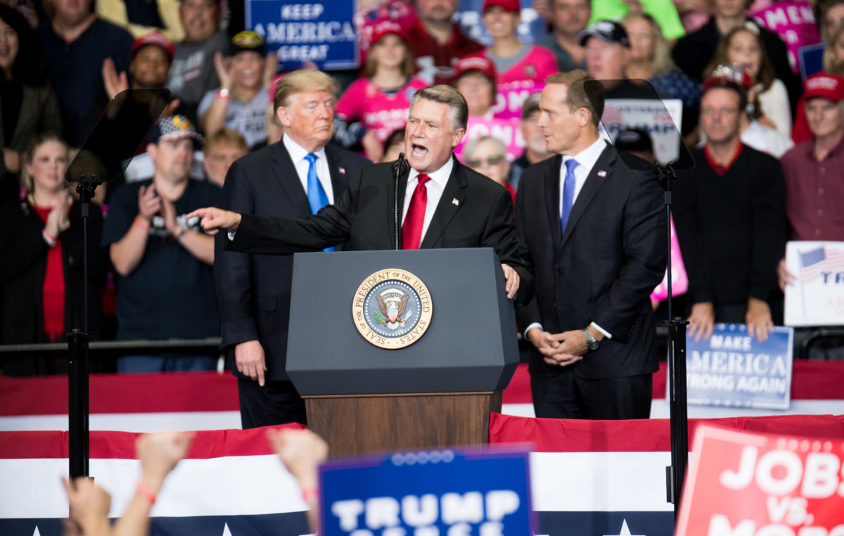 Republican congressional candidate Mark Harris addresses the crowd as President Trump listens at the Bojangles Coliseum on October 26, 2018, in Charlotte, North Carolina.