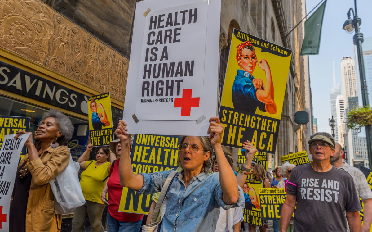 Activists march in New York City on September 5, 2017. Ongoing efforts to sabotage Medicaid and deny coverage to immigrant families will increase the uninsured.