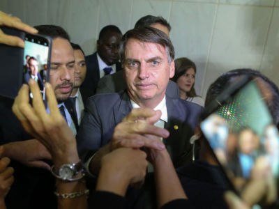 Brazil's President-elect Jair Bolsonaro greets people during his visit to the Superior Court of Labour in Brasilia, on November 13, 2018.