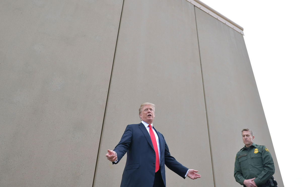 President Trump inspects border wall prototypes with Chief Patrol Agent Rodney S. Scott of the US Border Patrol in San Diego, California, on March 13, 2018.