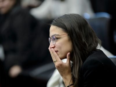 US Representative-elect Alexandria Ocasio-Cortez looks on during the drawing for new offices on Capitol Hill, November 30, 2018, in Washington, DC.