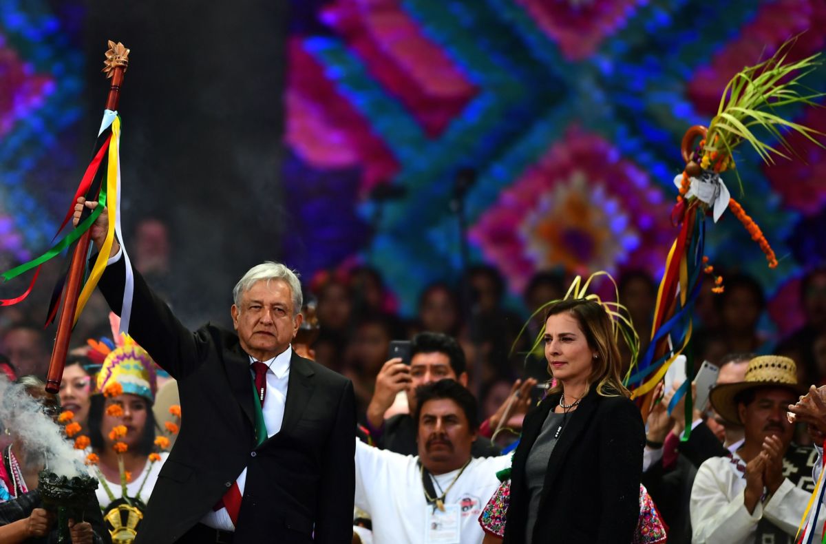 Mexican President Andrés Manuel López Obrador attends a ceremony in which he received a ceremonial staff from Indigenous people, next to his wife Beatriz Gutiérrez Müller, at the Zocalo Square in Mexico City, on December 1, 2018.