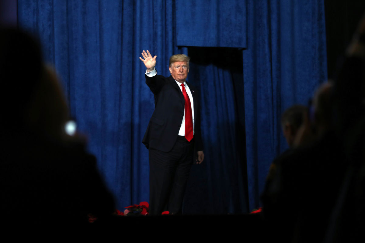President Trump waves to a crowd after addressing the Project Safe Neighborhoods National Conference at the Westin Crown Center on December 7, 2018, in Kansas City, Missouri.