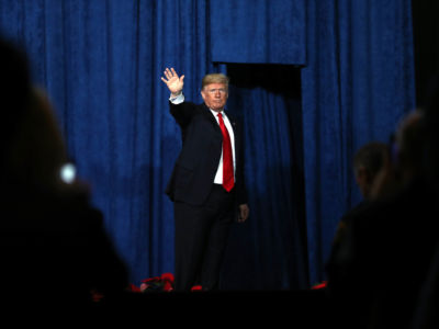 President Trump waves to a crowd after addressing the Project Safe Neighborhoods National Conference at the Westin Crown Center on December 7, 2018, in Kansas City, Missouri.