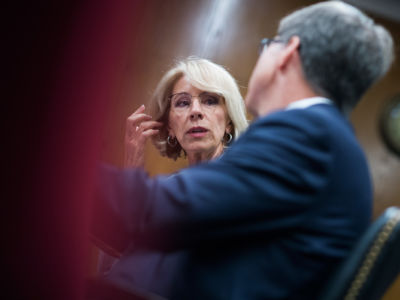 Education Secretary Betsy DeVos talks with with Bill Cordes of the department's Budget Service before testifying in front of a Senate subcommittee on the department's budget request for fiscal year 2019 on June 5, 2018.