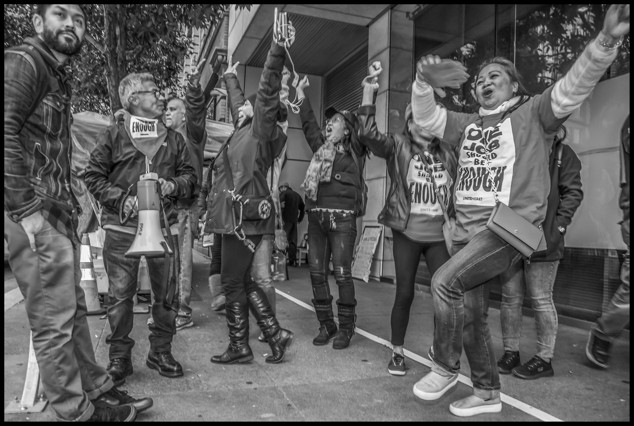 In front of the St. Regis Hotel, striker Camucha King and other Local 2 members celebrate the end of the strike.