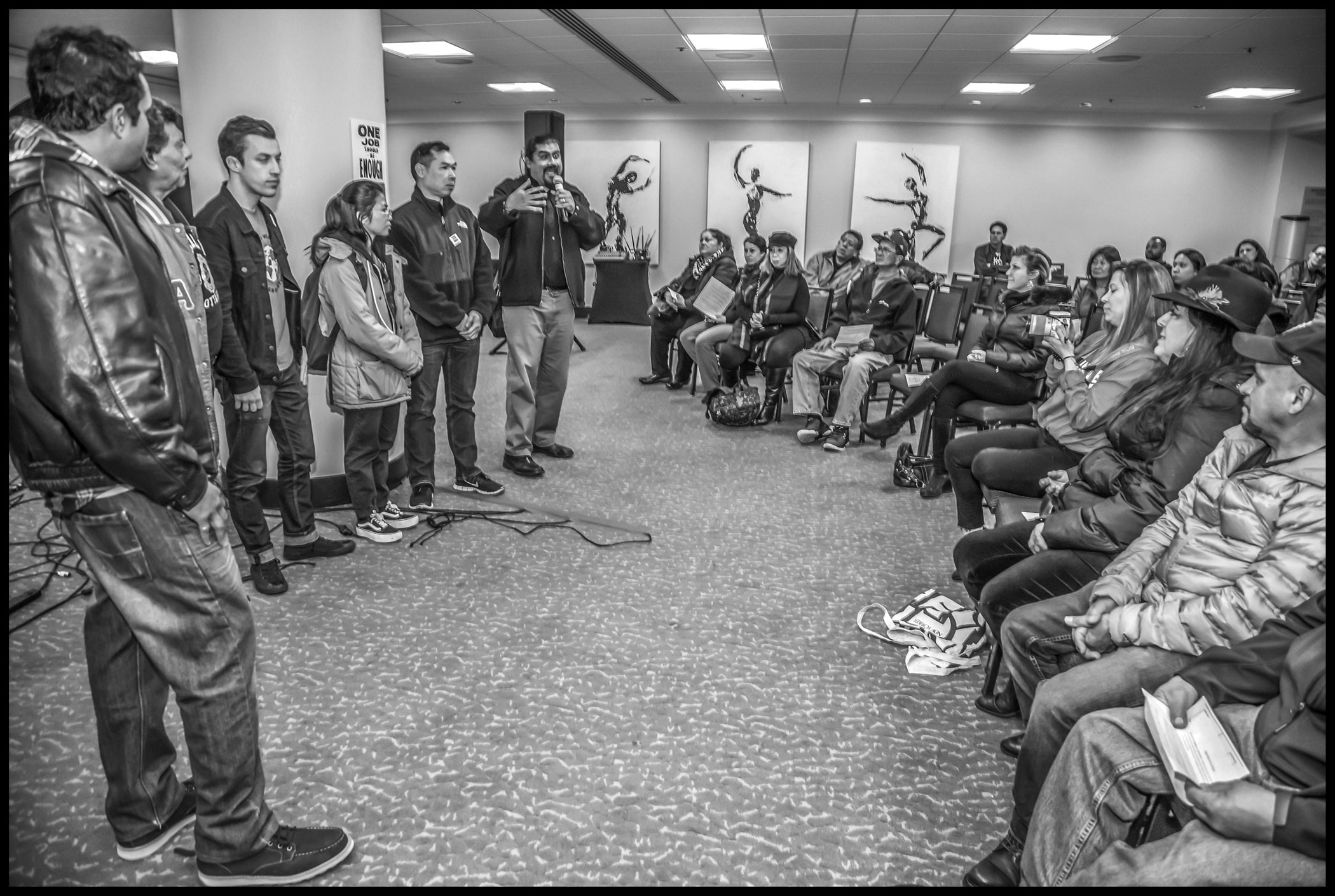 Nonunion workers at the downtown JW Marriott Hotel come to the contract ratification meeting ending the Marriott strike, asking strikers to support them in their unionizing effort.