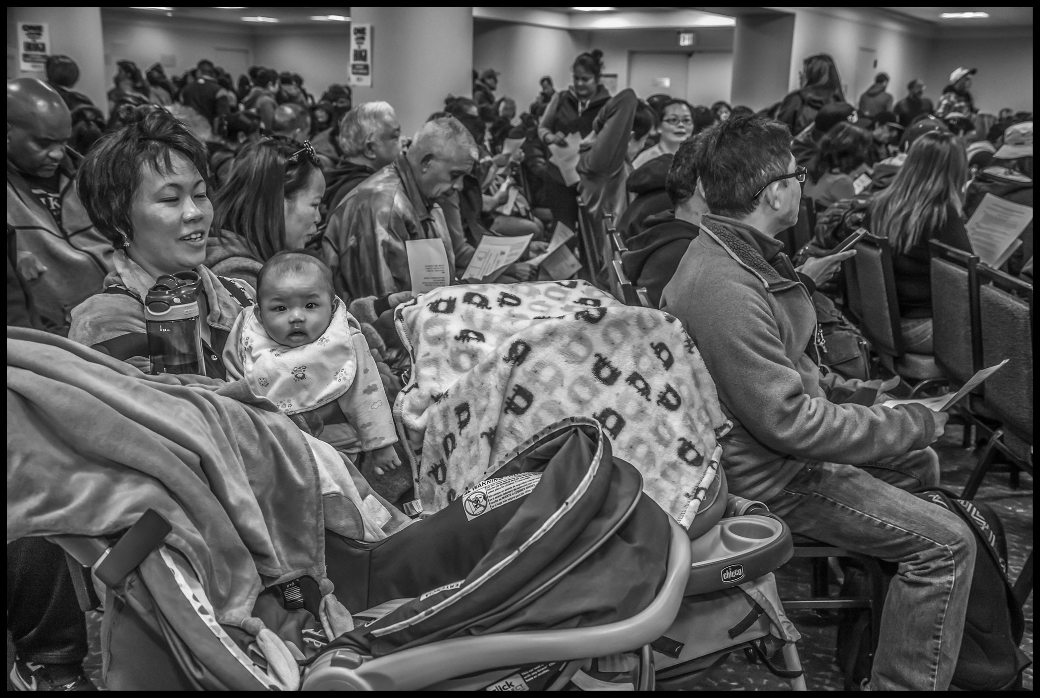 Hotel housekeepers bring their children and infants to the strike ratification meeting.