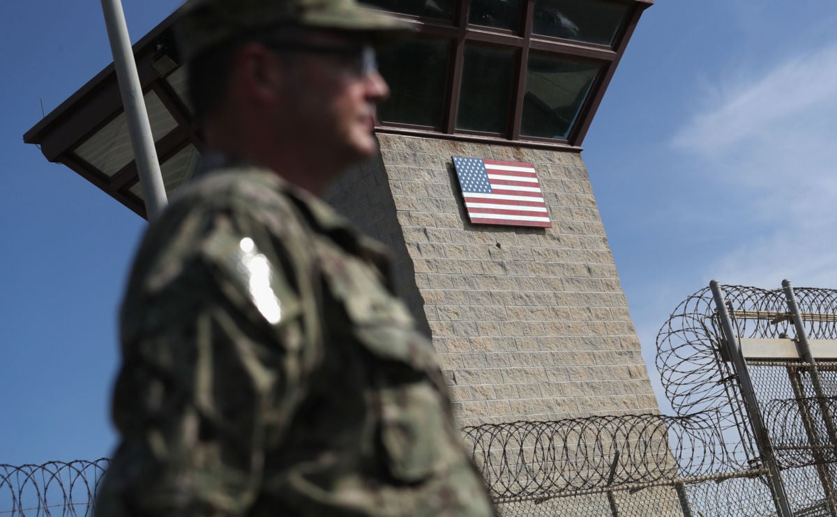 A US Naval officer stands at the entrance of the US prison at Guantanamo Bay, Cuba, on October 22, 2016.