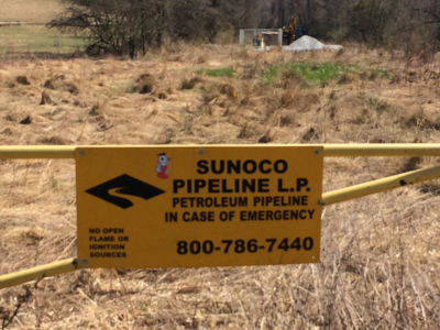 Sunoco Pipeline sign near Mariner East II pipeline site in Delaware County, Pennsylvania.