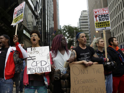 Demonstrators march after hearing the verdict in the murder trial of Chicago police officer Jason Van Dyke along Michigan Avenue on October 5, 2018, in Chicago, Illinois. Van Dyke was found guilty of second-degree murder and 16 counts of aggravated battery in the shooting death of 17-year-old Laquan McDonald on October 20, 2014.