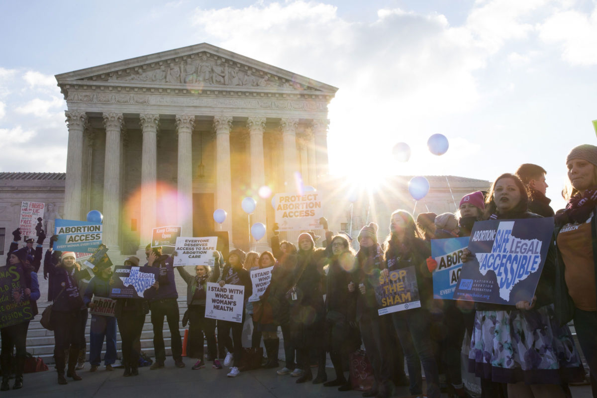 Pro-choice advocates rally outside of the Supreme Court on March 2, 2016, in Washington, DC. We owe it to ourselves — and to the communities that may be struggling just a little bit worse than we are — to do better.