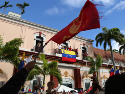 Venezuela's President Nicolás Maduro (C) greets his supporters during a gathering against oppositions' rallies in front of the Miraflores Palace in Caracas on January 23, 2019.