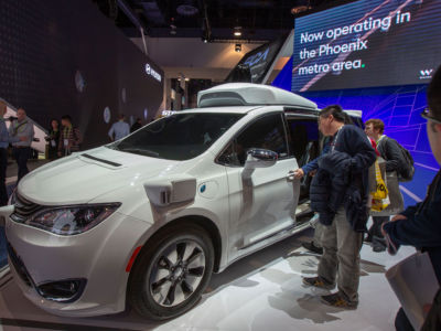 People look at the Waymo car, formerly the Google self-driving car project, during the Las Vegas Convention Center during CES 2019 in Las Vegas on January 9, 2019.