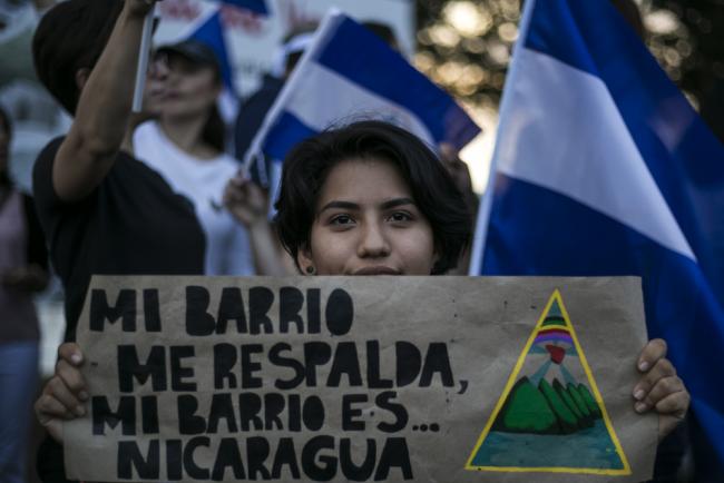 "My neighborhood backs me... my neighborhood is Nicaragua." Student protester at an SOS Nicaragua protest against Daniel Ortega in Managua in May, 2018. 