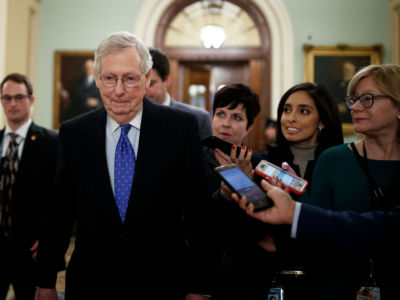 Reporters question US Senate Majority Leader Mitch McConnell at Capitol Hill in Washington, DC, on December 19, 2018.