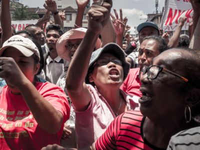 Supporters of the Malagasy opposition presidential candidate Marc Ravalomanana gesture and chant slogans during a rally at the 13 Mai Plaza, in Antananarivo, on December 29, 2018, to protest against the provisional results announced by the Independent National Electoral Commission.