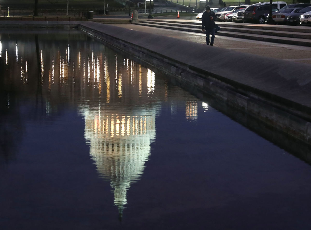 A reflection of the US Capitol is seen on the 12th day of a partial shutdown of the US government, on January 2, 2019, in Washington, DC.