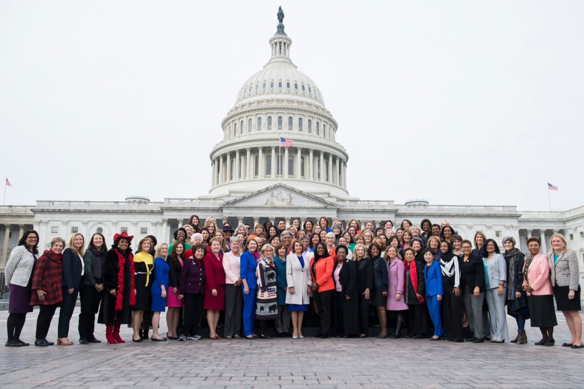 Speaker Nancy Pelosi poses with Democratic women members of the House after a group photo on the East Front of the Capitol on January 4, 2019.