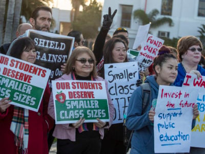 Teachers, retired teachers and parents show their support for the United Teachers of Los Angeles in front of Venice High School in Venice, California, on January 10, 2019.