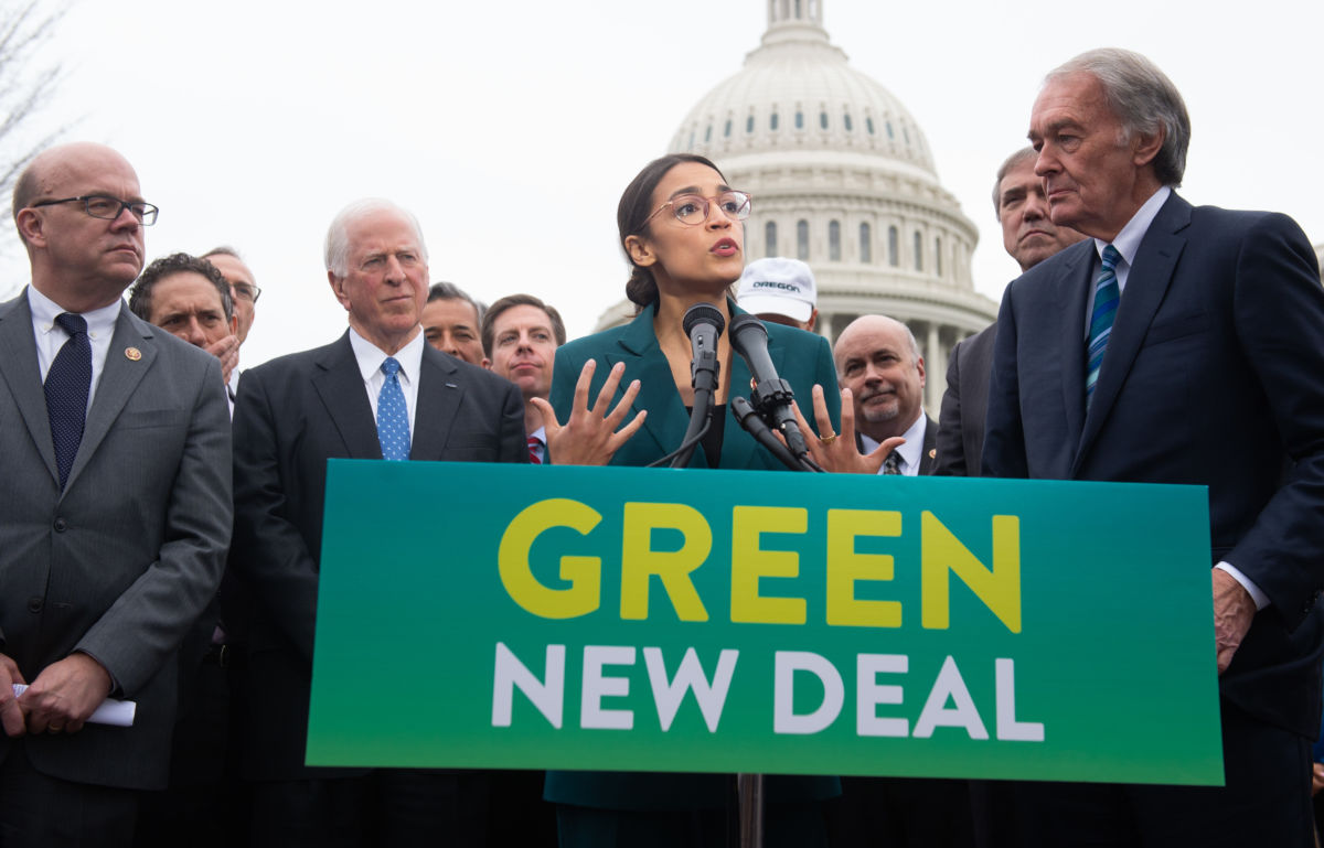 US Representative Alexandria Ocasio-Cortez, Democrat of New York, and US Senator Ed Markey (R), Democrat of Massachusetts, speak during a press conference to announce Green New Deal legislation to promote clean energy programs outside the US Capitol in Washington, DC, February 7, 2019.