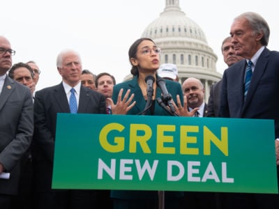 US Representative Alexandria Ocasio-Cortez, Democrat of New York, and US Senator Ed Markey (R), Democrat of Massachusetts, speak during a press conference to announce Green New Deal legislation to promote clean energy programs outside the US Capitol in Washington, DC, February 7, 2019.