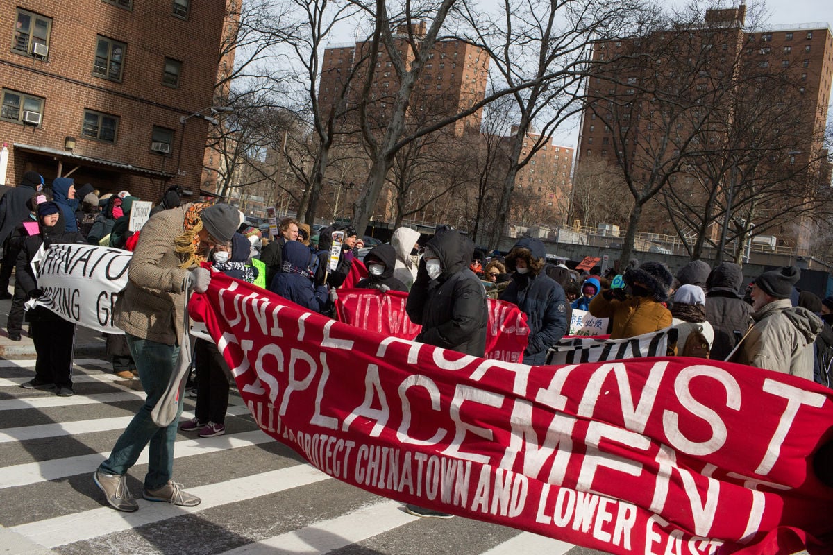 On a cold Martin Luther King Day, Lower East Side residents join housing rights activists outside the first of the "Two Bridges" luxury towers to be built on January 21, 2019, in New York City.