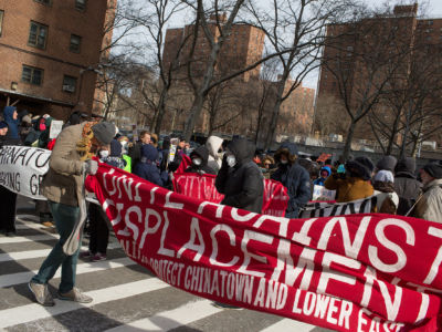 On a cold Martin Luther King Day, Lower East Side residents join housing rights activists outside the first of the "Two Bridges" luxury towers to be built on January 21, 2019, in New York City.