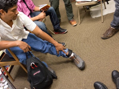 Immigration activists meet with people seeking political asylum to help them with their legal process at a Manhattan church on September 27, 2016, in New York City. The church has been declared a sanctuary for undocumented immigrants.