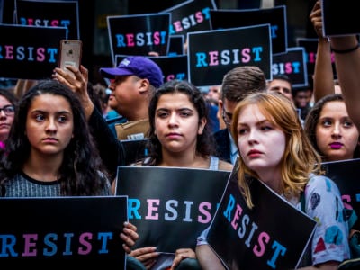 Protesters demonstrate in opposition to President Trump's tweets proposing to ban transgender people from military service during an action on July 26, 2017, in New York City.