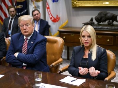 President Trump watches as former Florida Attorney General Pam Bondi speaks during a meeting with state and local officials on school safety in the Roosevelt Room of the White House on February 22, 2018, in Washington, DC.