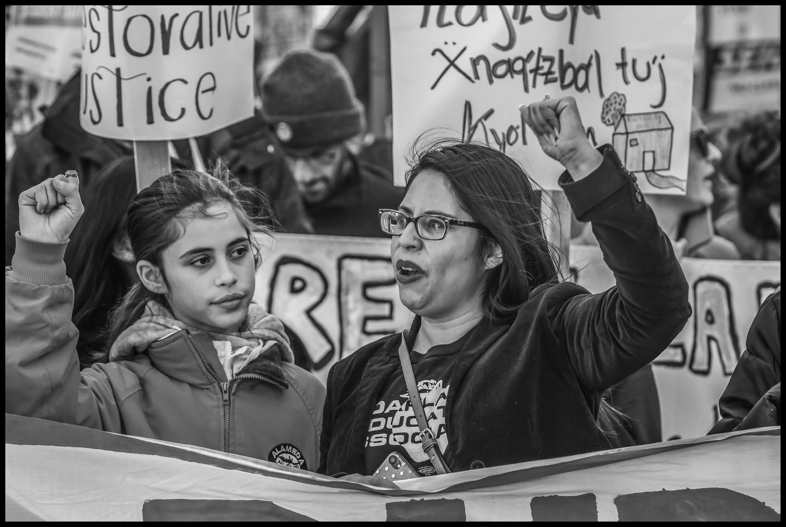 Liz Ortega, executive secretary of the Alameda Labor Council, behind the banner during the march.