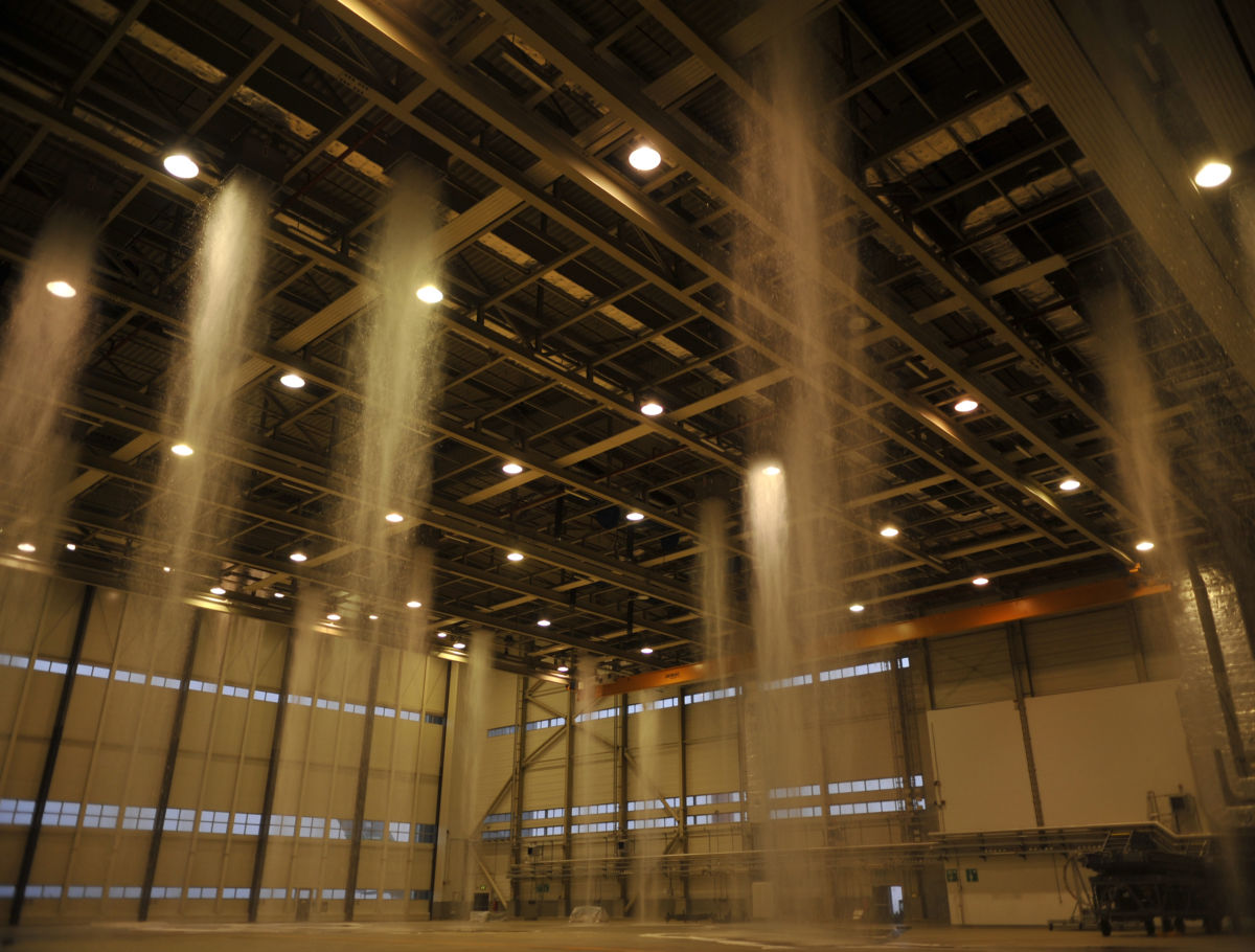 Poisonous foam fills the hangar at Ramstein Air Base, Germany, during a biennial fire suppression system test, February 19, 2015.