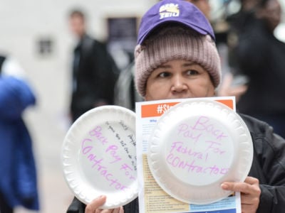 On January 23, hundreds of members of the American Federation of Government Employees, other union members, federal employees and contractors, and allies held a silent protest against the federal shutdown at the Hart Senate Office Building in Washington, DC. Among their demands was back pay for federal contractors, who currently are not eligible for it under law.