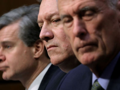 (L-R) FBI Director Christopher Wray, CIA Director Mike Pompeo, Director of National Intelligence Dan Coats and other intelligence community officials testify before the Senate Intelligence Committee in the Hart Senate Office Building on Capitol Hill, February 13, 2018, in Washington, DC.