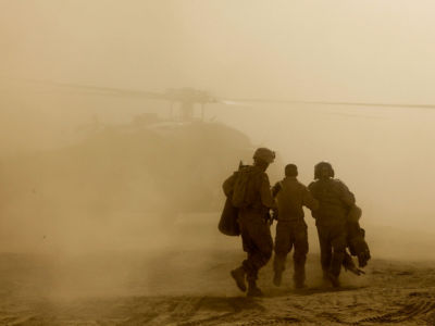 US marines head to a UH-60 Black Hawk helicopter in the Nawa district of the Helmand Province of Afghanistan, August 4, 2009. Rumors swirl of a ceasefire in Afghanistan, but key sectors of Afghan society have been excluded from the talks.