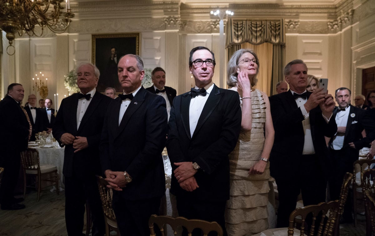 Treasury Secretary Steve Mnuchin stands with others during a state dinner at the White House on Tuesday, April 24, 2018, in Washington, DC. Many 2020 presidential candidates are pushing taxation on the rich to reduce the US's staggering inequality.