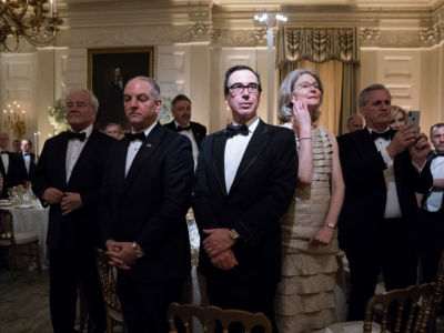 Treasury Secretary Steve Mnuchin stands with others during a state dinner at the White House on Tuesday, April 24, 2018, in Washington, DC. Many 2020 presidential candidates are pushing taxation on the rich to reduce the US's staggering inequality.