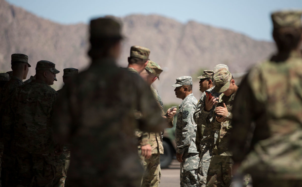 Members of the Arizona National Guard take a break on April 9, 2018, at the Papago Park Military Reservation in Phoenix. New Mexico Governor Michelle Lujan Grishman has ordered the recall of most of the National Guard from the border in her state.