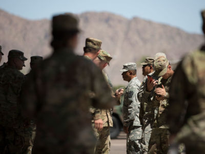 Members of the Arizona National Guard take a break on April 9, 2018, at the Papago Park Military Reservation in Phoenix. New Mexico Governor Michelle Lujan Grishman has ordered the recall of most of the National Guard from the border in her state.