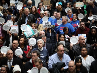 Furloughed federal workers and those aligned with them protest the partial government shutdown in the Hart Senate Office Building January 23, 2019, in Washington, D.C.