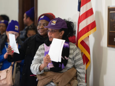 Furloughed contract workers, including security officers and custodians who have not been paid during the partial government shutdown, hold unpaid bills to present to the office of Senate Majority Leader Mitch McConnell on Capitol Hill in Washington, D.C., January 16, 2019.