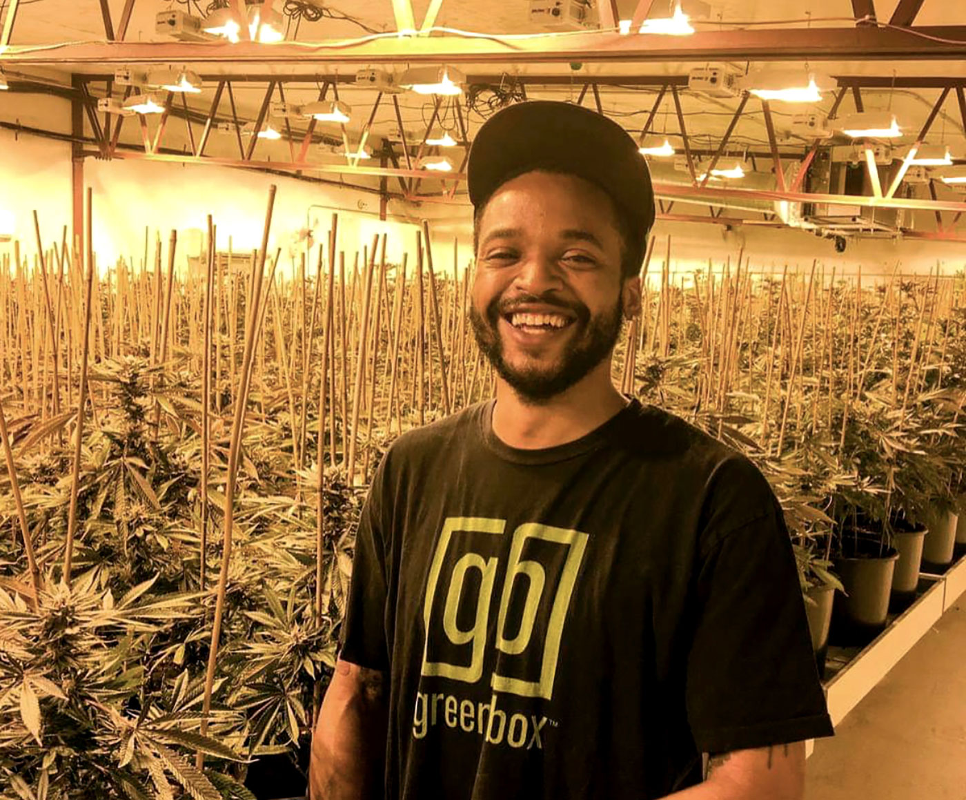 Adrian Wayman, founder of Green Box, at a supplier's indoor grow. Wayman was awarded a $30,000 grant from the city to help bolster his marijuana delivery business. Photo from Green Box.